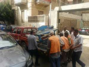 رفع 10 إشغالات من شارع سعد زغلول بحي السويس وتغريم المخالفين